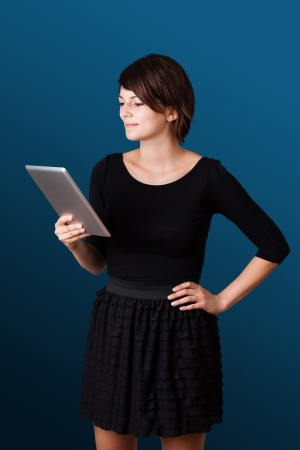 Young business woman looking at modern tablet の写真素材