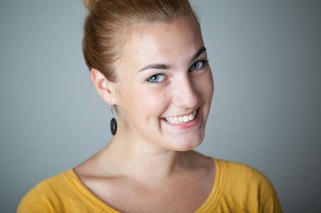 Closeup of young girl giving you beautiful smile