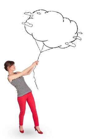 Pretty young lady holding cloud balloon drawingの写真素材