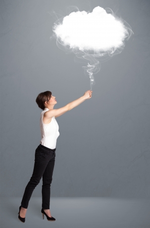 Beautiful young woman holding cloudの写真素材