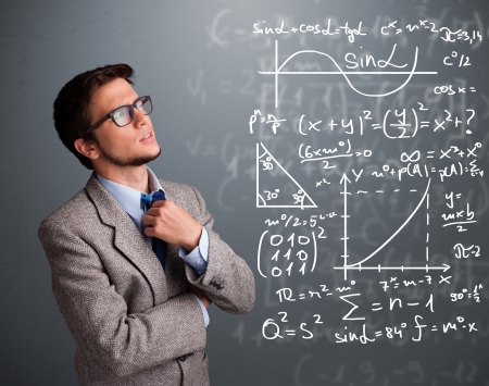 Handsome young school boy thinking about complex mathematical signsの写真素材