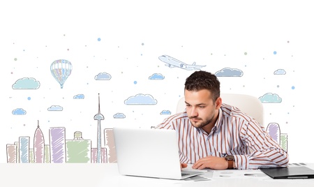 Attractive young businessman with city sky-scape backgroundの写真素材