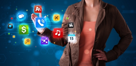 Young woman pressing various collection of high tech buttonsの写真素材