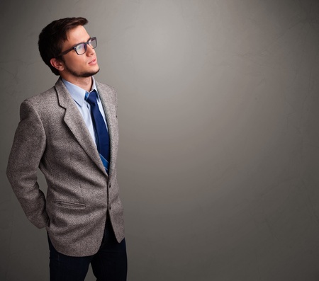 Handsome young man thinking with empty copy spaceの写真素材