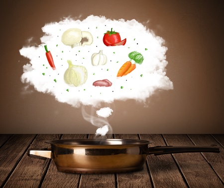 Vegetables in vapor steam above cooking potの写真素材