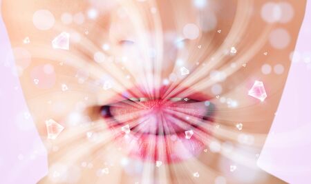 Beautiful girl mouth breathing abstract white lights and crystals close upの写真素材