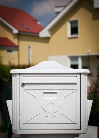 Cloes up of a mailbox on the street with fenceの写真素材