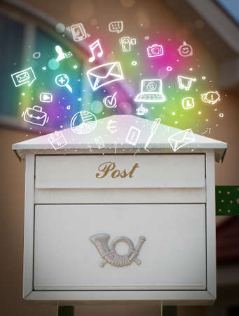 Colorful modern icons and symbols bursting out of a mailboxの写真素材