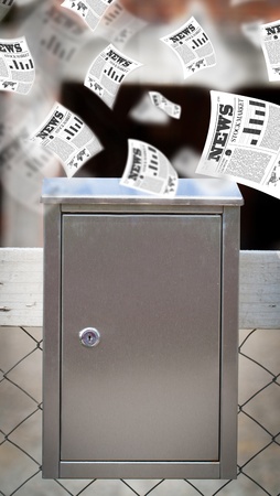 Post box with daily newspapers flying outの写真素材