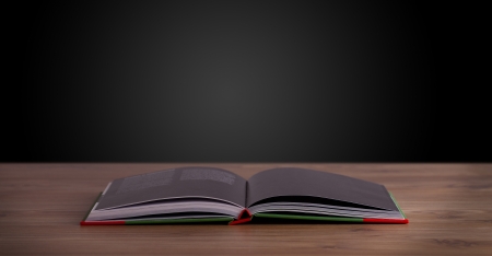 Open book on wooden deck and copy spaceの写真素材