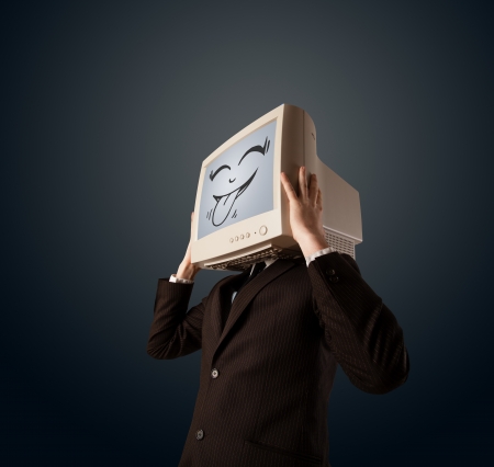 Happy business man with a computer monitor screen and a smiley faceの写真素材