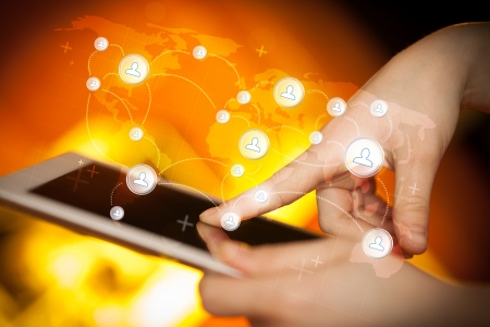 Finger pointing on tablet pc, social network conceptの写真素材