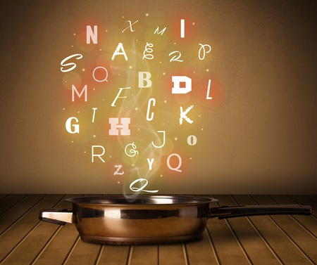 Colorful letters coming out from cooking potの写真素材