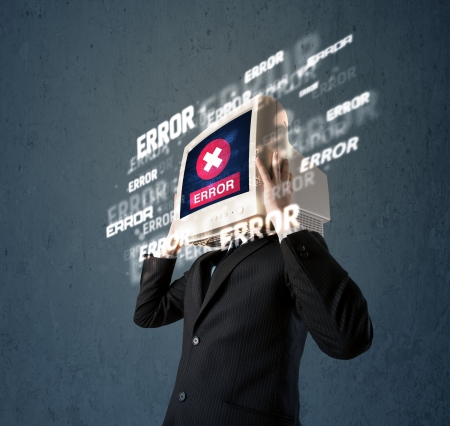 Business man with pc monitor on his head and error messages darker backgroundの写真素材