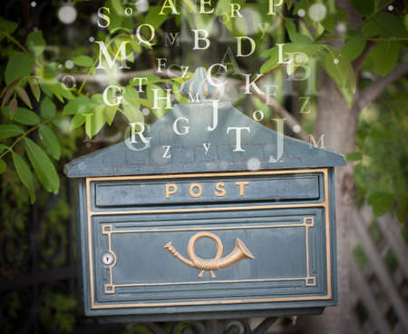 Street mail box with letters comming outの写真素材