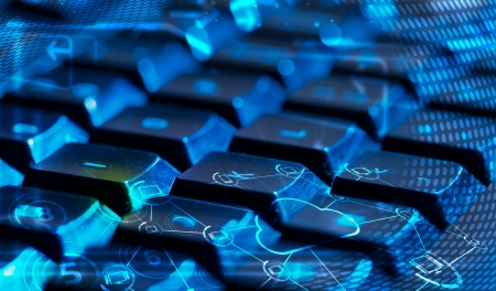 Computer keyboard with glowing cloud computing and multimedia icons