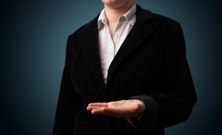 Young girl presenting with hand empty copy spaceの写真素材