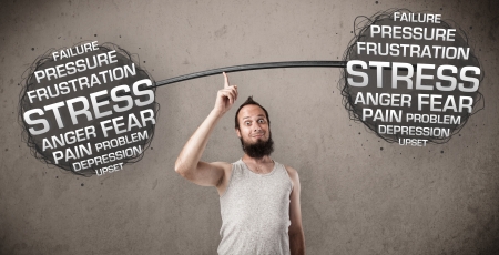 Funny skinny guy defeating stressの写真素材