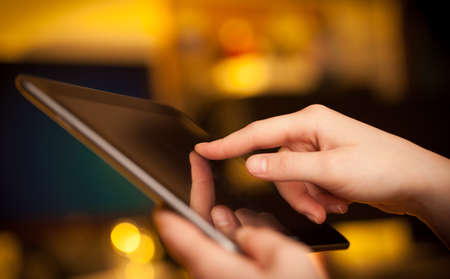 Hand touching tablet pc with copy space