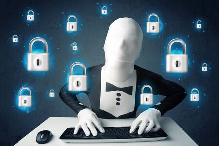 Hacker in disguise with virtual lock symbols and icons on blue backgroundの写真素材