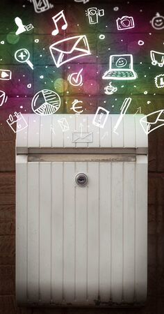 Colorful modern icons and symbols bursting out of a mailbox