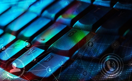 Computer keyboard with glowing icons, social networking concept