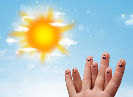 Cheerful happy smiling fingers with bright sun and clouds illustrationの写真素材