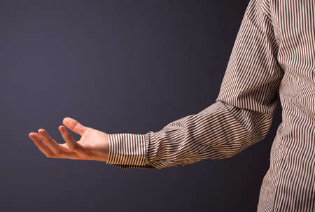 Businessman presenting empty spaceの写真素材