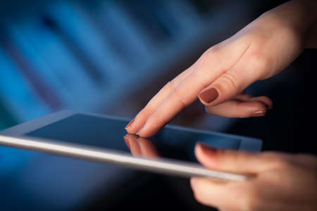 Hand touching tablet pc with copy space