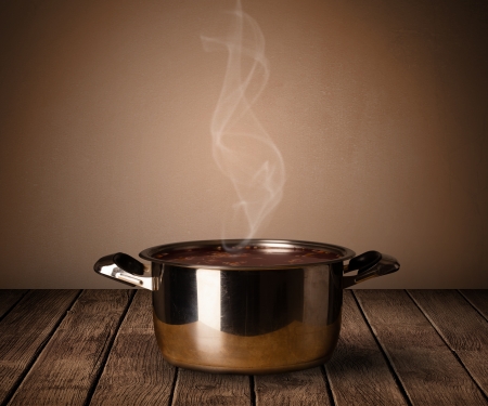 cooking pot on old wooden tableの写真素材