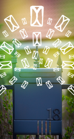 Mailbox with letter icons exploding on glowing green backgroundの写真素材