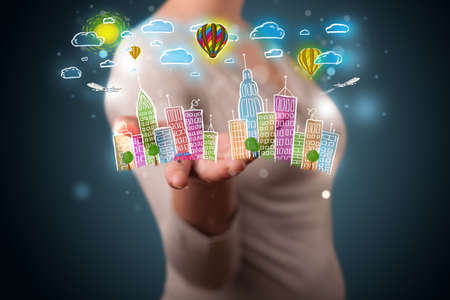 Young beautiful woman presenting hand drawn metropolitan cityの写真素材