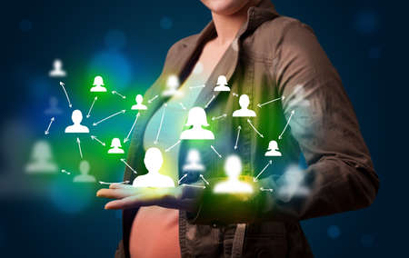 Young beautiful woman presenting modern technology social network mapの写真素材