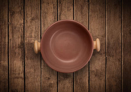 Colorful empty shiny plate on grungy background table の写真素材