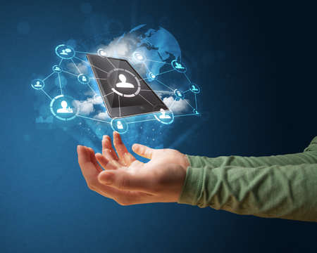 Young businesswoman presenting cloud technology in her hand