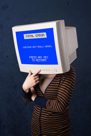 Person with a monitor head and fatal error blue screen on the display