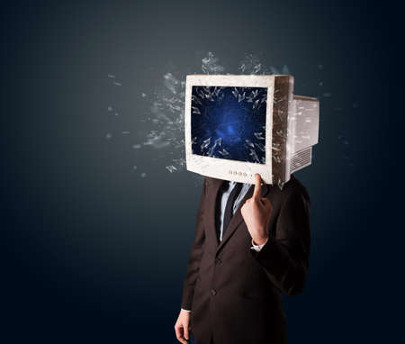 Computer monitor screen exploding on a young persons head conceptの写真素材