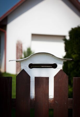 Cloes up of a mailbox on the street with fenceの写真素材