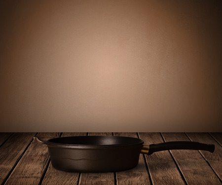 cooking pot on old wooden tableの写真素材