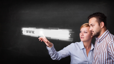 Young couple touching web browser address bar with www sign
の写真素材