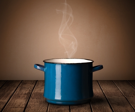 cooking pot on old wooden tableの写真素材