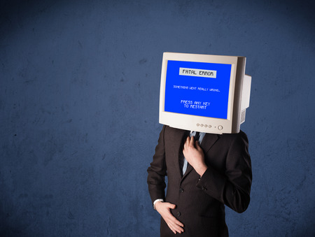 Person with a monitor head and fatal error blue screen on the display