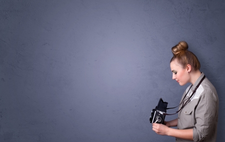 Photographer girl shooting images with copyspace areaの写真素材