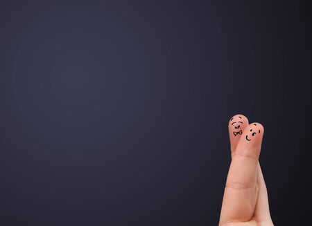 Happy cheerful smiley fingers looking at empty wall copyspaceの写真素材