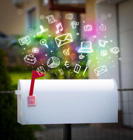 Colorful modern icons and symbols bursting out of a mailboxの写真素材