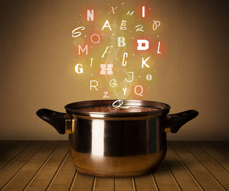 Colorful letters coming out from cooking potの写真素材