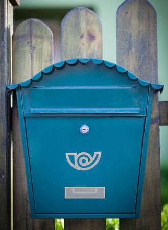Cloes up of a mailbox on the street with fenceの写真素材