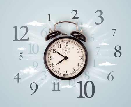 Modern clock with numbers on the side and clouds