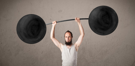 Funny skinny guy lifting incredible weightsの写真素材