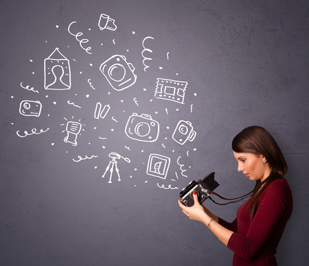 Young photographer girl shooting photography iconsの写真素材